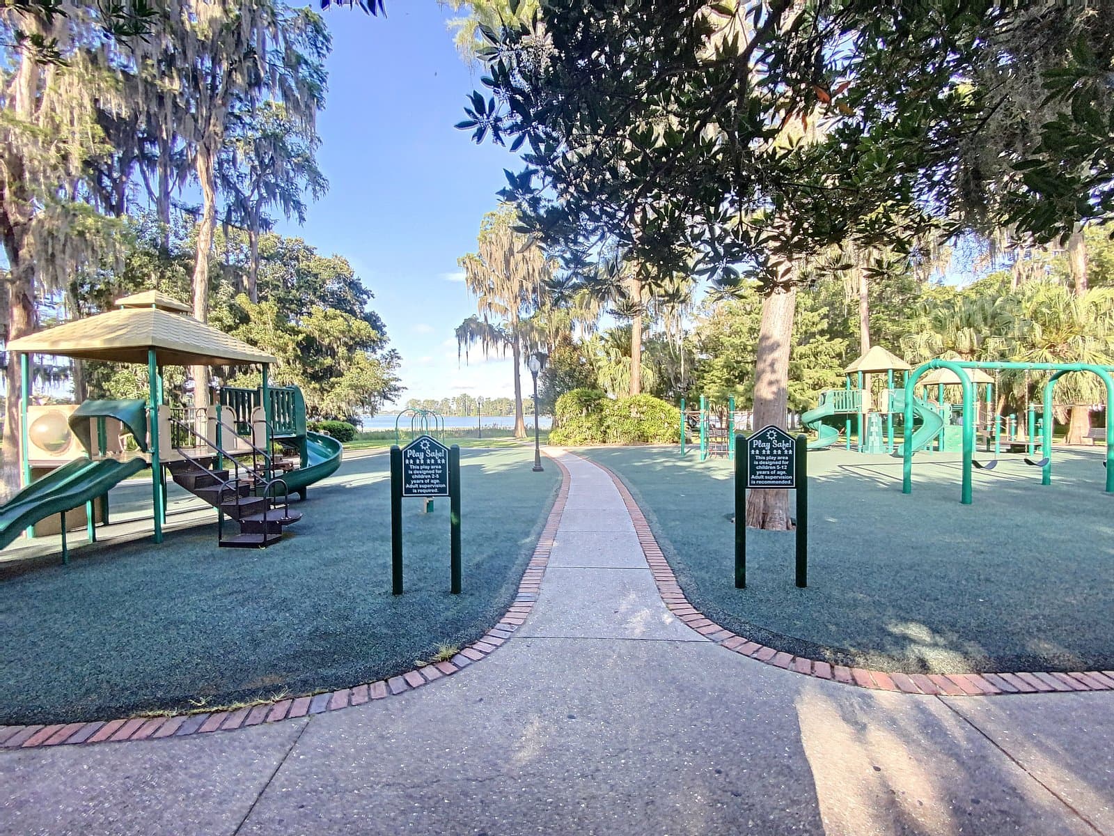 Cypress Grove Park playground with brick path leading to the lake