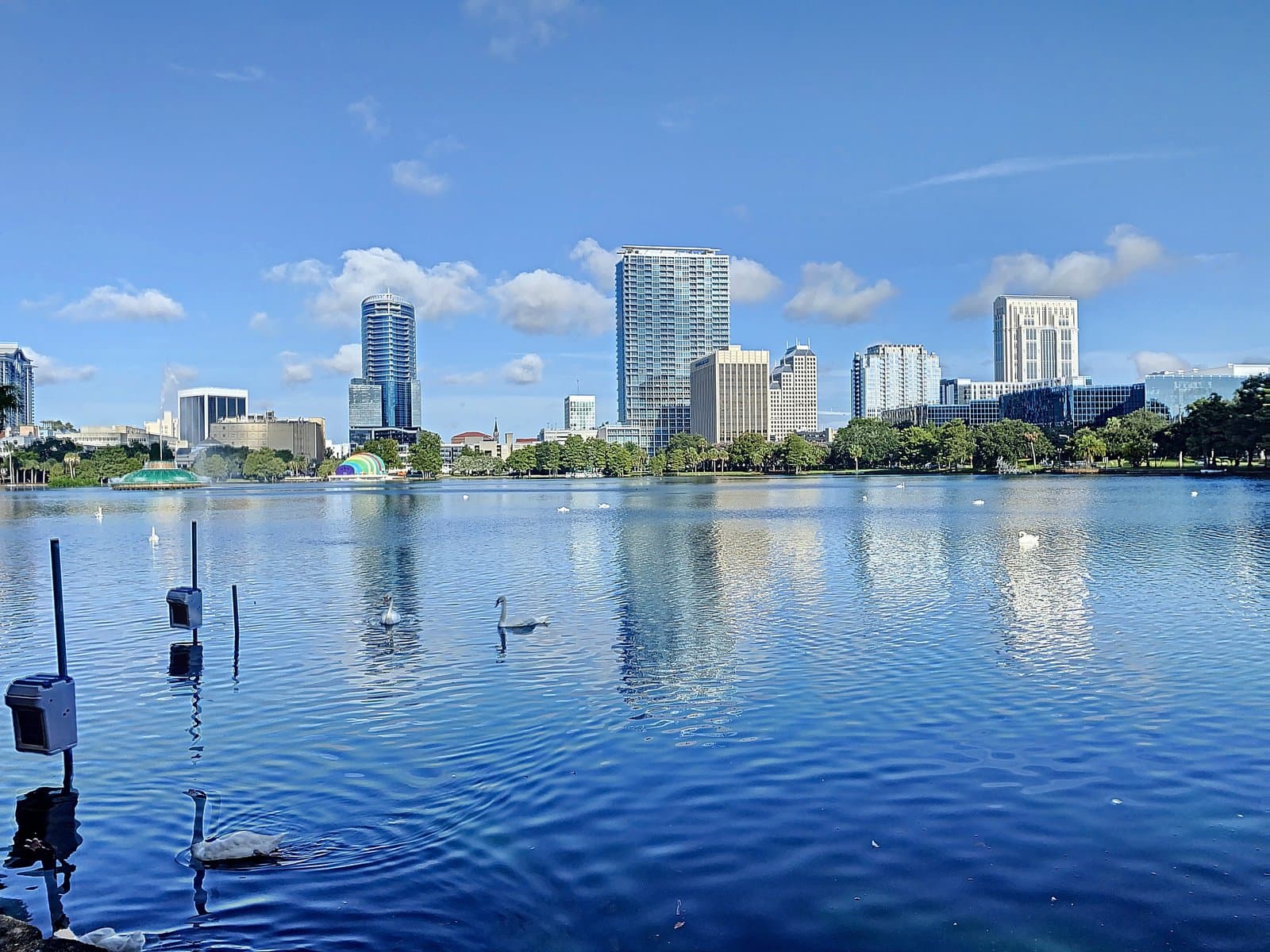 Lake Eola panorama with the downtown skyline reflected on calm water
