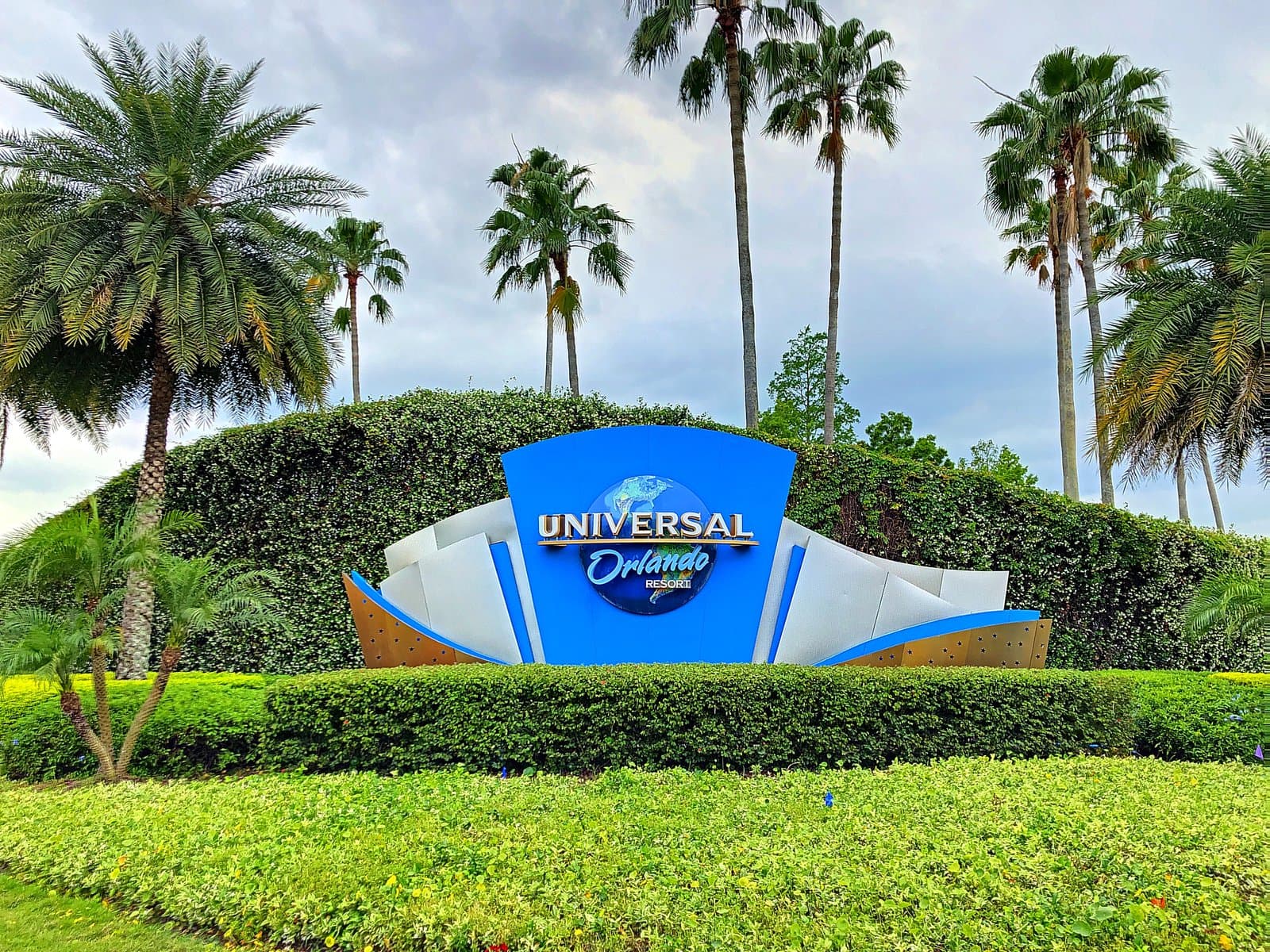 Universal Orlando Resort entrance sign with palm trees