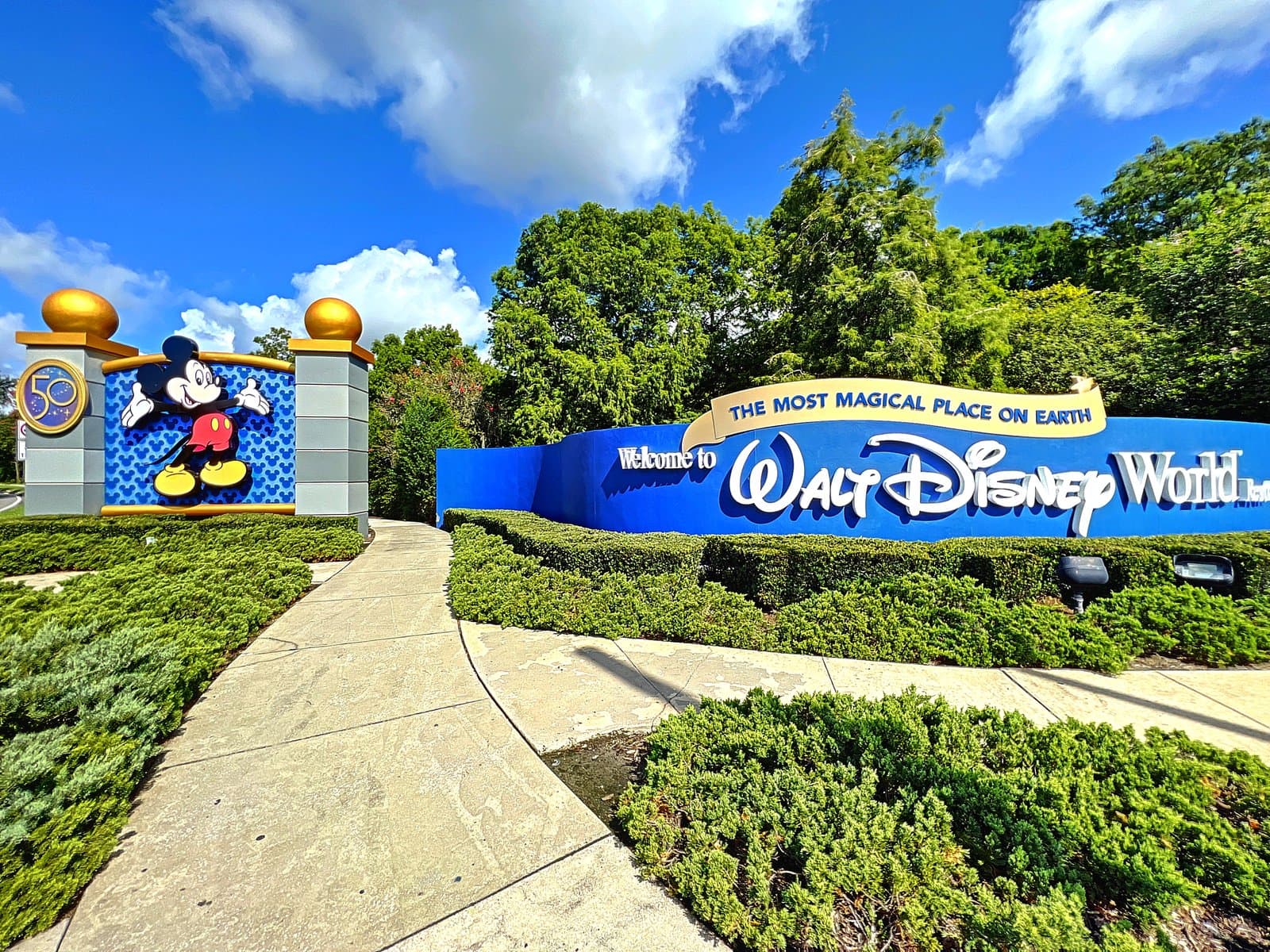 Welcome to Walt Disney World entrance sign with Mickey Mouse 50th anniversary monument