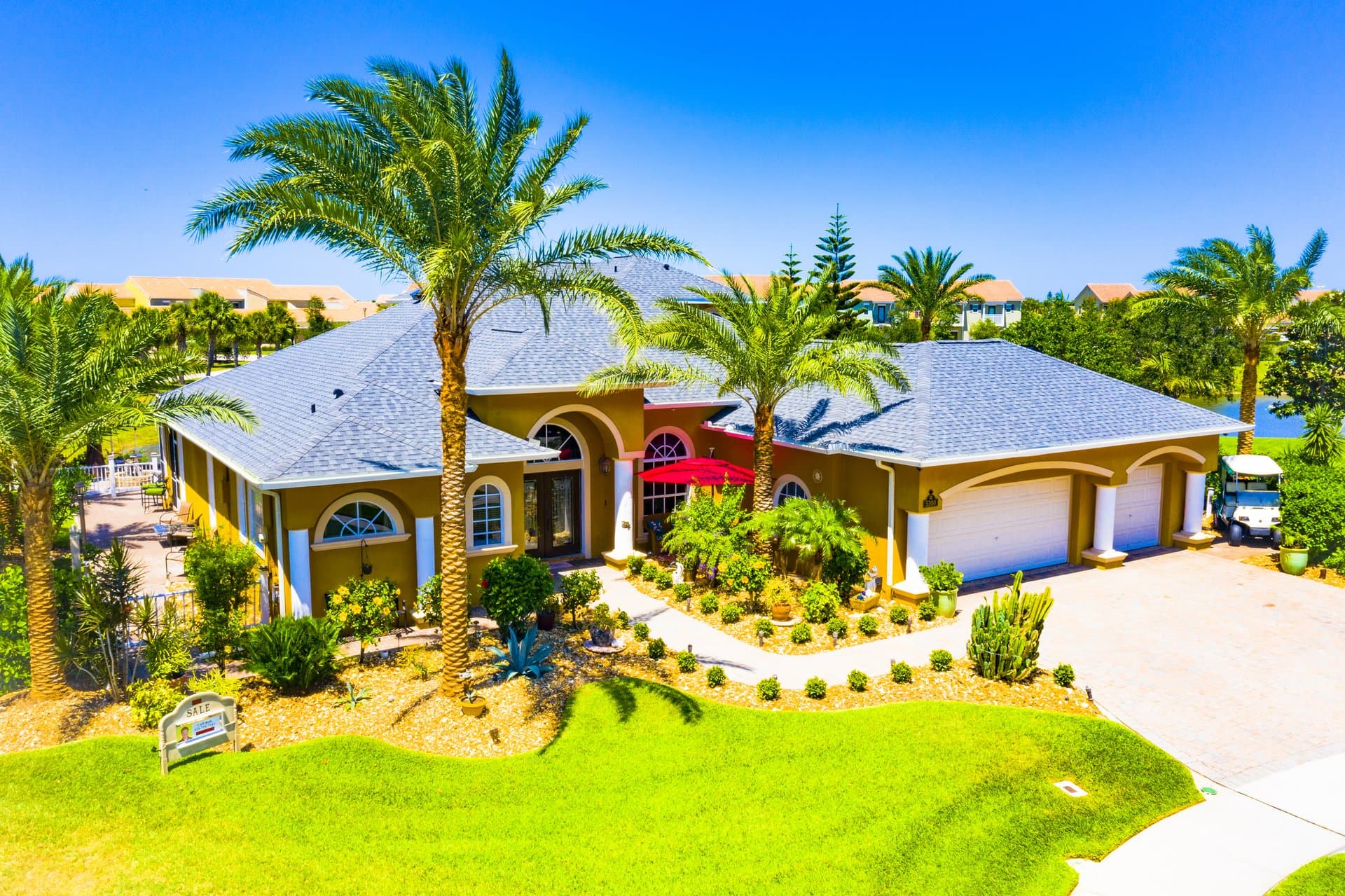 Luxury Mediterranean home in Viera with palm landscaping
