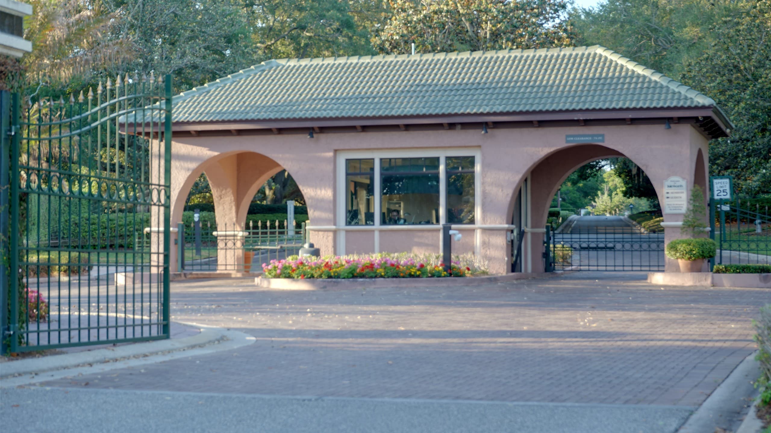 Isleworth's iconic pink Mediterranean guard house at the main entrance, Windermere, FL