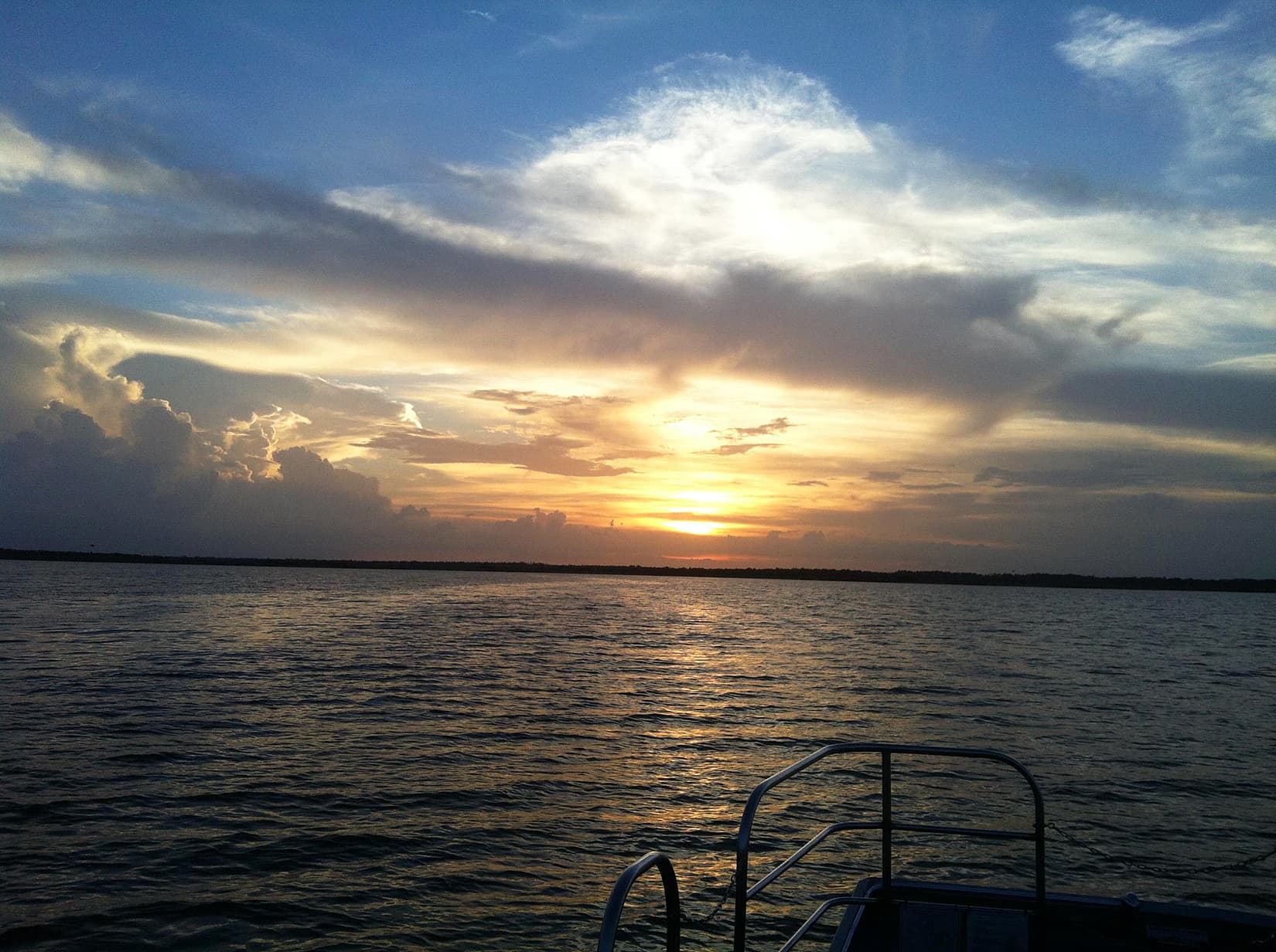 Dramatic sunset over Lake Jesup from a boat in Oviedo, Florida