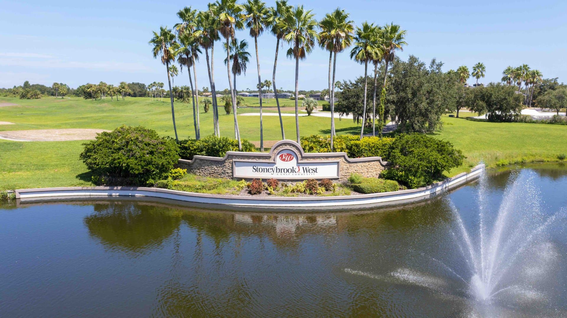 Stoneybrook West community entrance with fountain, monument sign, and championship golf course, Winter Garden FL